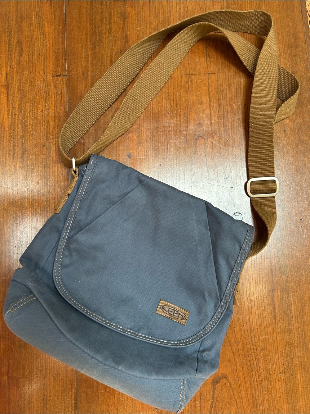 Keen Navy Canvas Messenger Bag w/adjustable webbed brown Strap. Flap front.